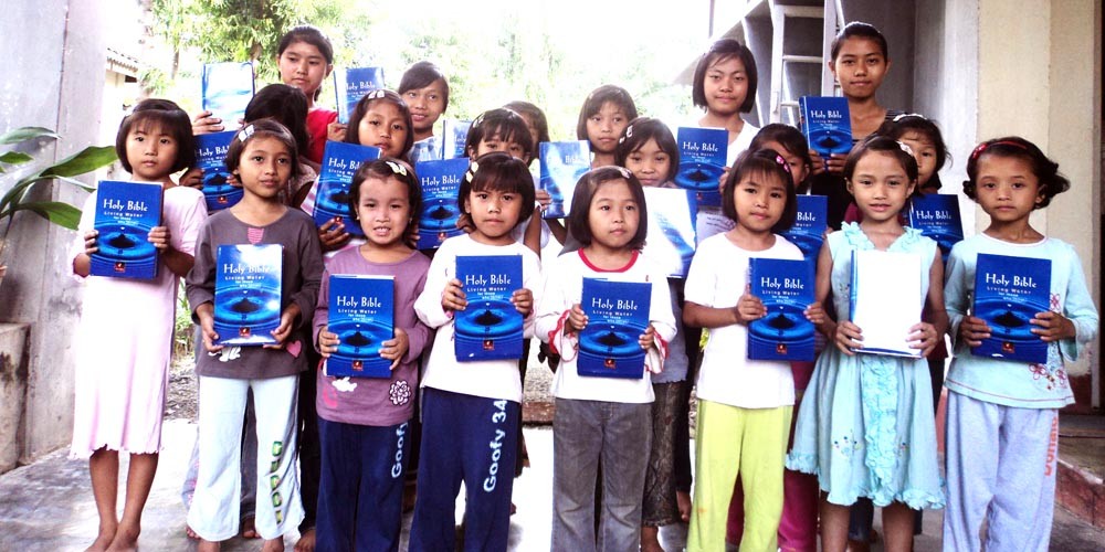 The children of Wondang-Ki orphanage showing off their bible- a fathers’ gift from Uncle Jimmy Teo from Singapore. (Morung photo)